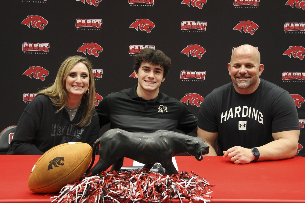Braden Jay with proud parents at Football Signing Day